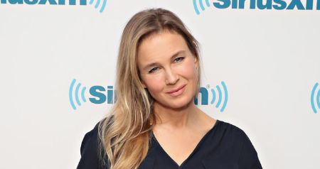 Renee Zellweger poses for the camera with a mild smile. Her net worth is over $60 million.