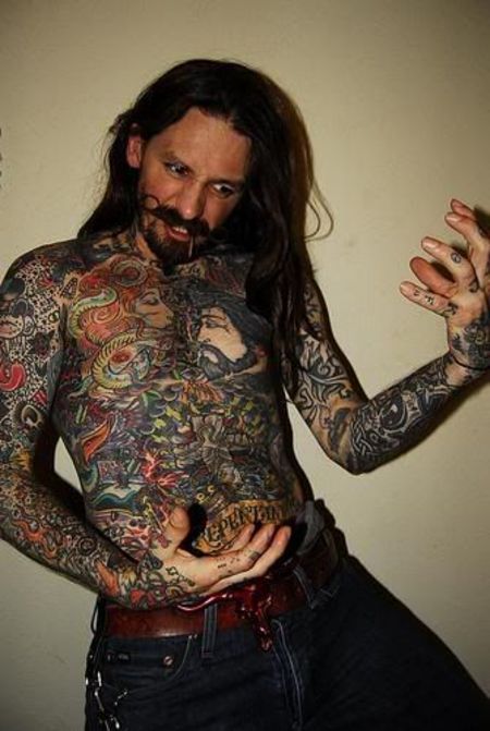 Oliver Peck shows off his full body tattoo. 