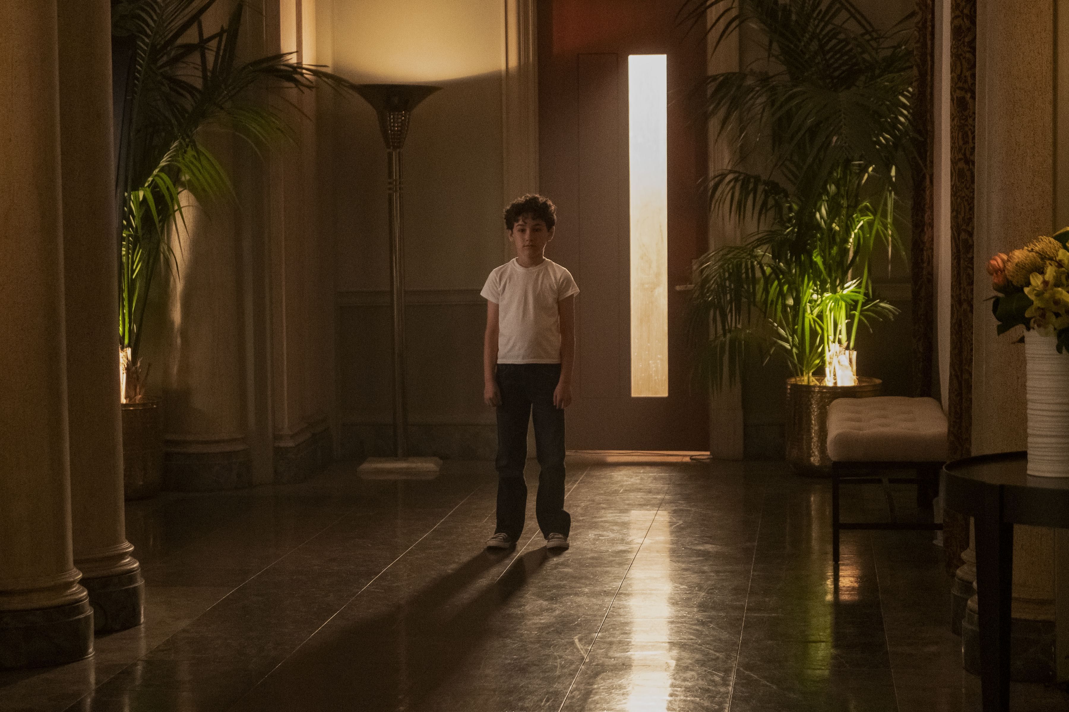 childhood joe standing in the hallway 