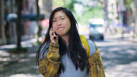 Awkwafina plays the fictional version of herself with her real name Nora Lum.