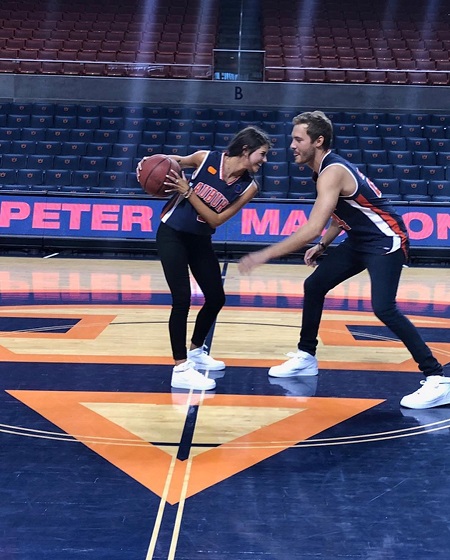 Madison Prewett and Peter Weber playing basketball.