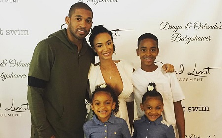 Draya Michele with her ex-fiancé Orlando Scandrick and his two kids as well as her own son.