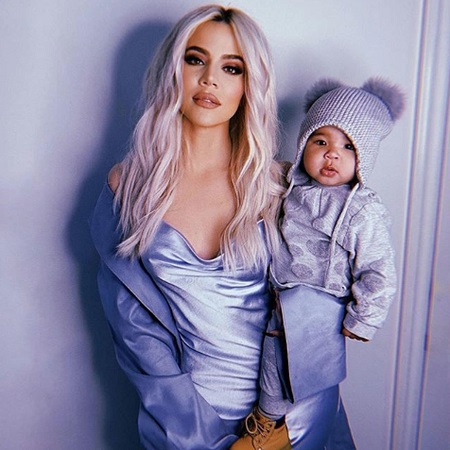 Khloé Kardashian holding baby True.