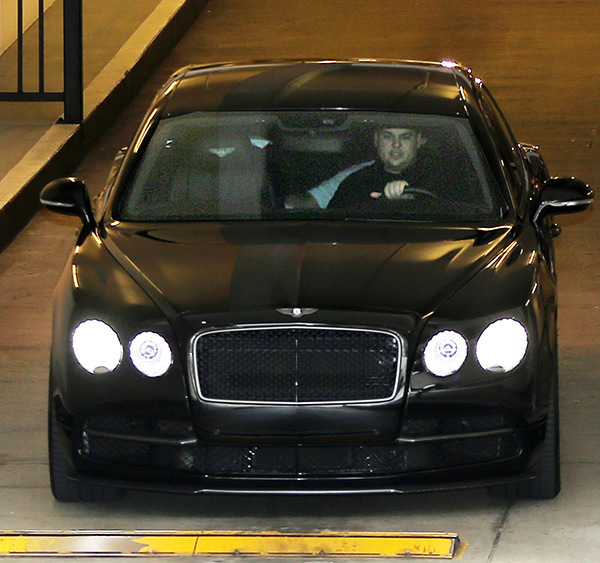 rob in his black bentley strolling around the street 
