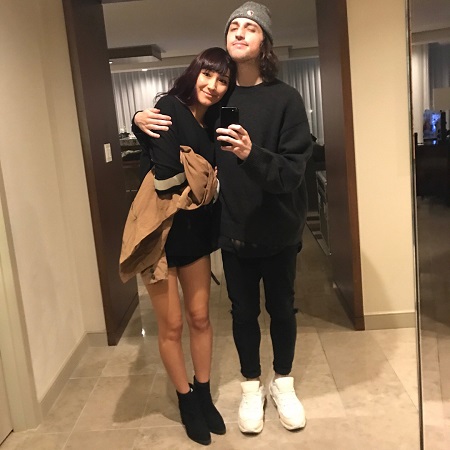 Porter Robinson with his girlfriend Rika Mikuriya in a mirror selfie.