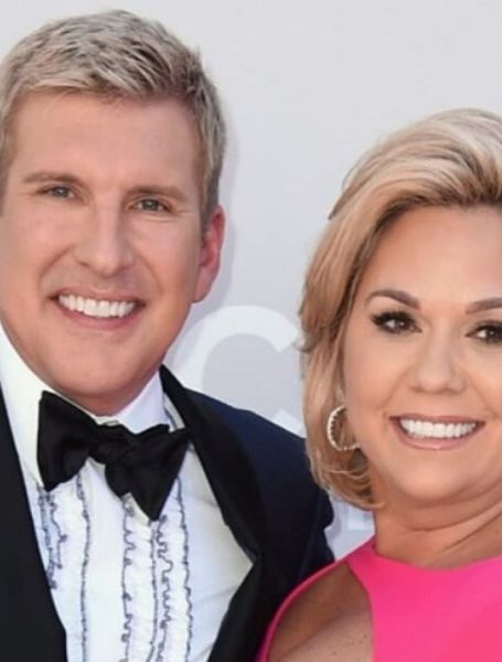 Todd Chrisley is with his wife.
