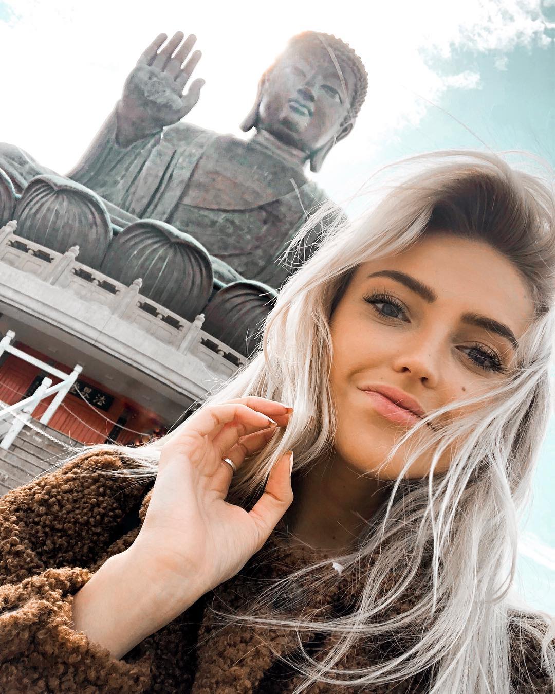 Morgan likes to travel and click photos on different places. here she has visited Tian Tan Buddha
