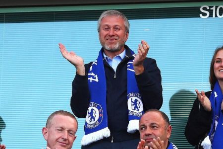 Roman Abramovich stands up and claps for the Chelsea football team