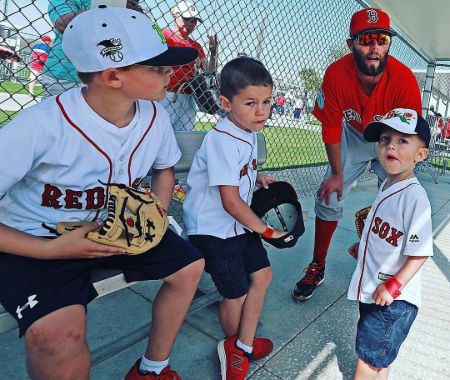 Dustin Pedroia with his kids, Dylan, Cole, and Brooks.