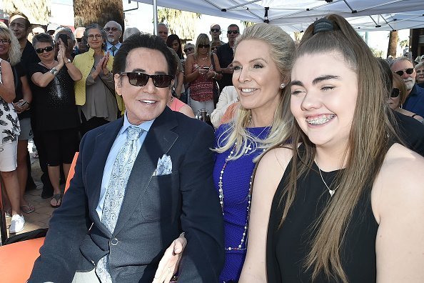 Wayne newton, his  second daughter and  Kathleen laughing in photo 