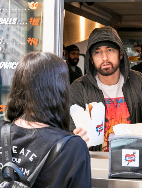 Eminem is serving his customer.