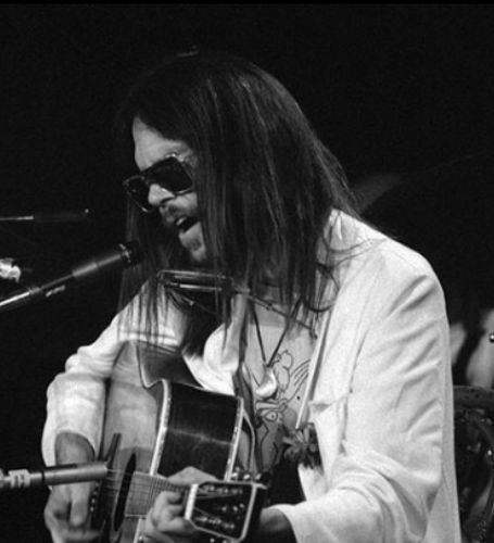 Neil Young is a singer, songwriter, and musician of Canadian and American descent.