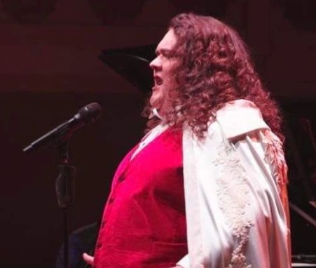 Jonathan Antoine performing in front of live audience.