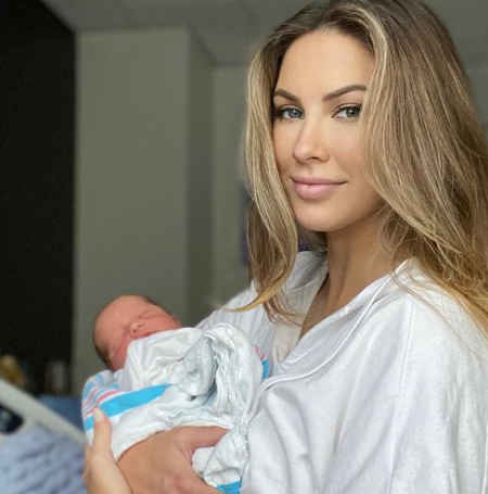 AJ McCarron's wife with their newborn baby boy.