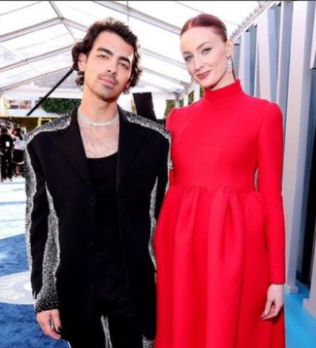 Sophie Turner flaunted her growing baby belly on the red carpet for the first time at the Vanity Fair Oscar Party with her husband Joe Jonas.